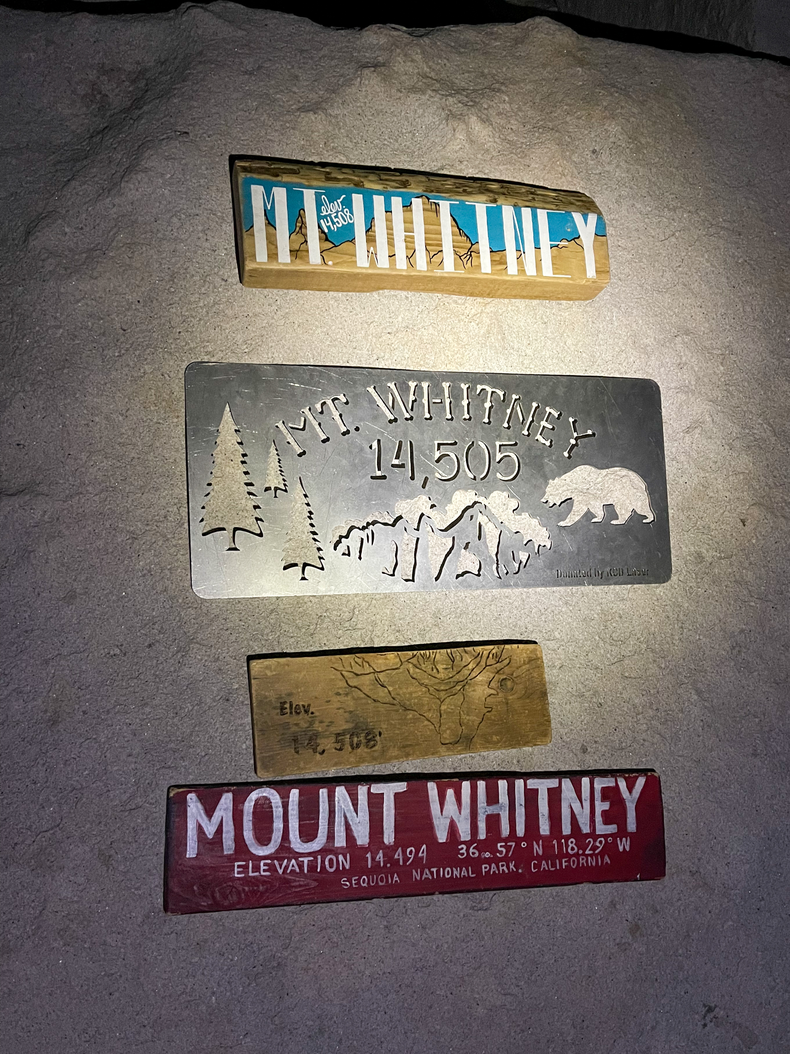 Multiple Mt. Whitney signs available on the summit
